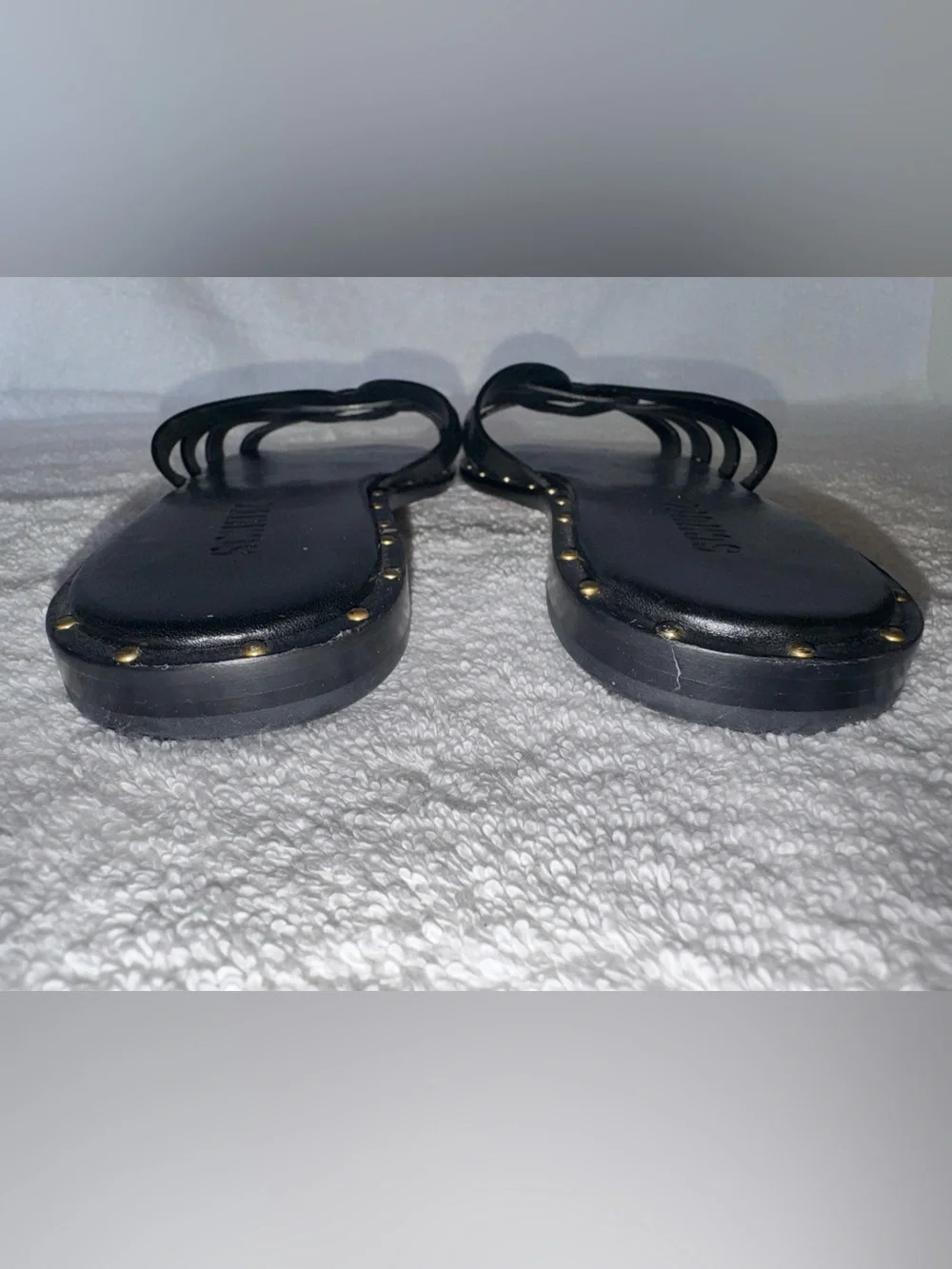 Schutz Phoenix flat sandals delicate woven straps n metallic stud along midsole.
